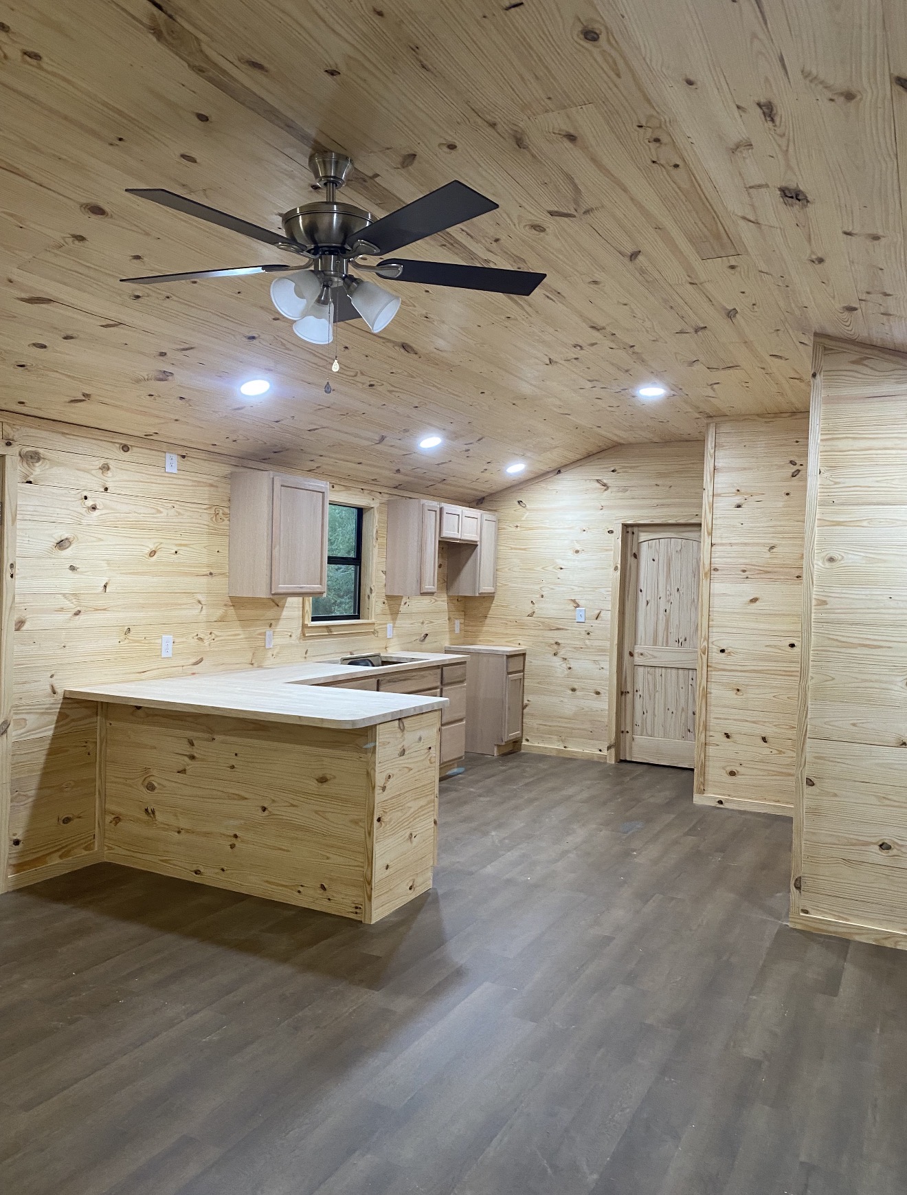 Tiny home living area with wood finishes